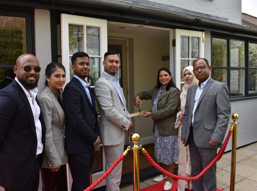 Priti cuts the ribbon and open’s new Indian restaurant in Kelvedon